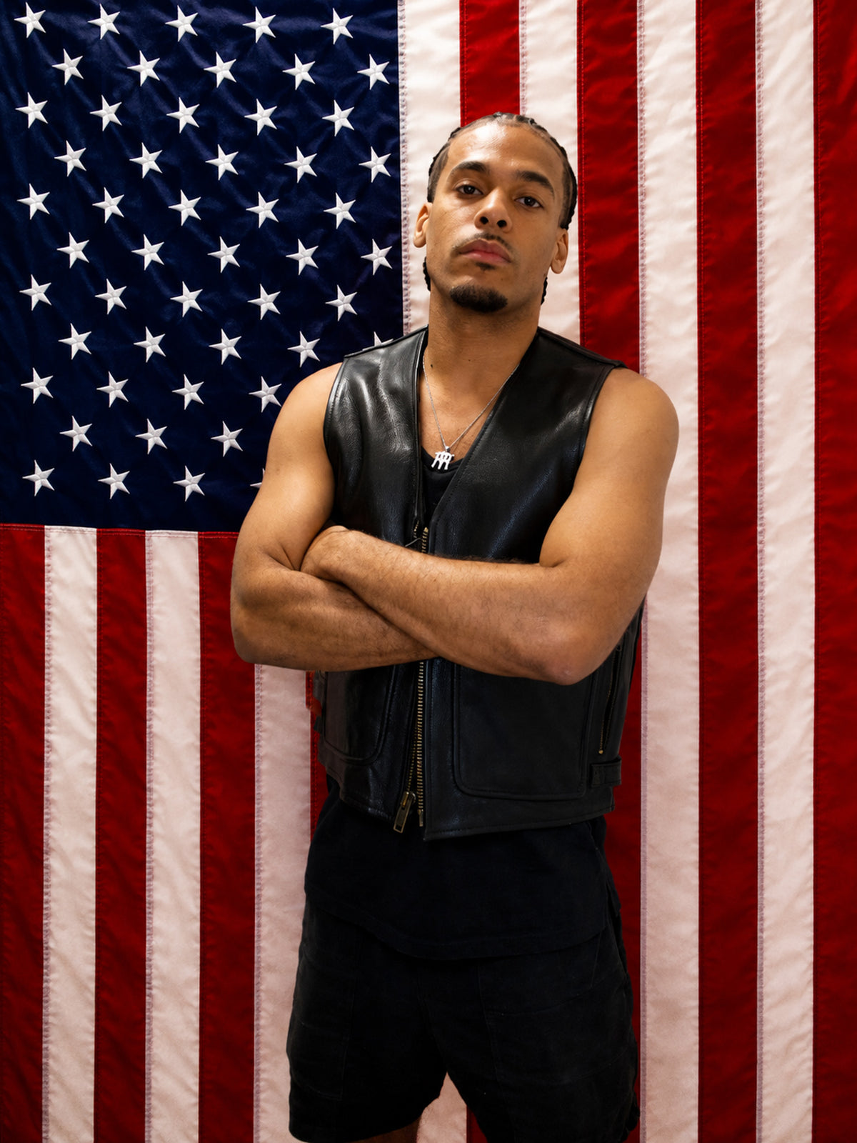 Young Americans campaign portrait featuring leather apparel before an American flag